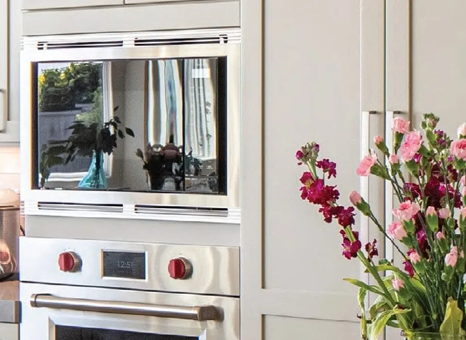 White kitchen cabinets and built-in appliances